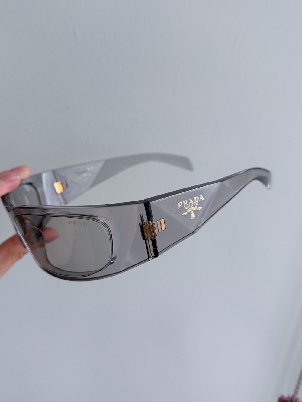 Prada Men’s Transparent Gray Shield Sunglasses with Gold Accents